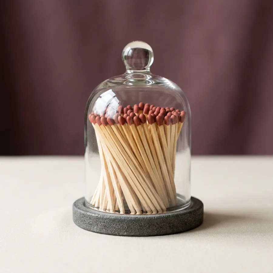Glass cloche of long matches with a striker base